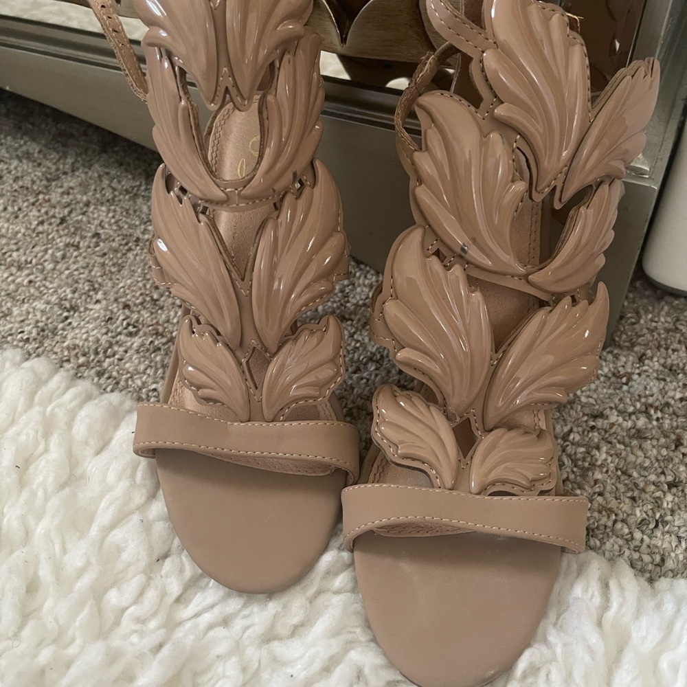 Designer inspired Nude strappy wing high heel stilettos. Size 6.